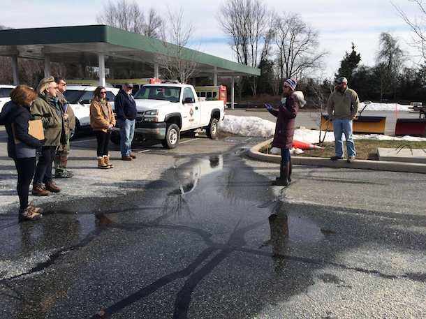 participants in the Cecil County Watershed Stewards Academy inspect a flooded parking lot