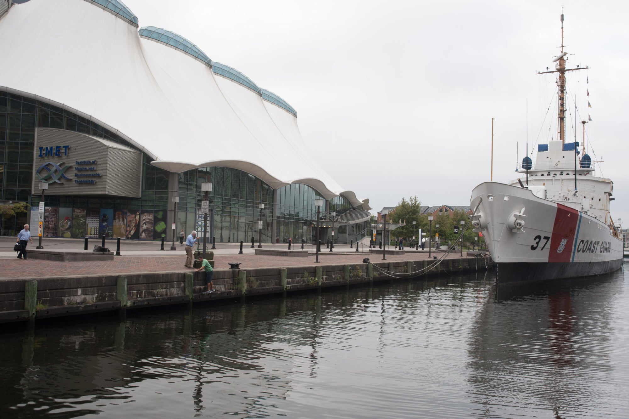 A ship docked alongside the IMET building in Baltimore's Inner Harbor