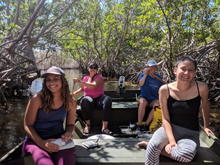 (Clockwise from lower left) Shakira Gómez Arias, Patricia N. Vidal Geraldino, UMCES post-doctoral researcher Leanne Powers, and Génesis López Santana paddle through a mangrove in Laguna Grande in Fajardo, Puerto Rico. Credit: Mike Allen / MDSG