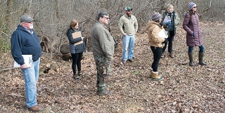 cecil county watershed steward trainees examine parking lot to understand how stormwater would drain off it.